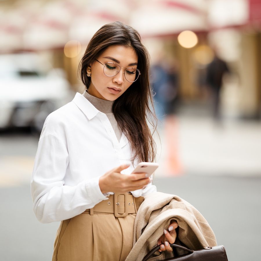 woman on her phone in the street