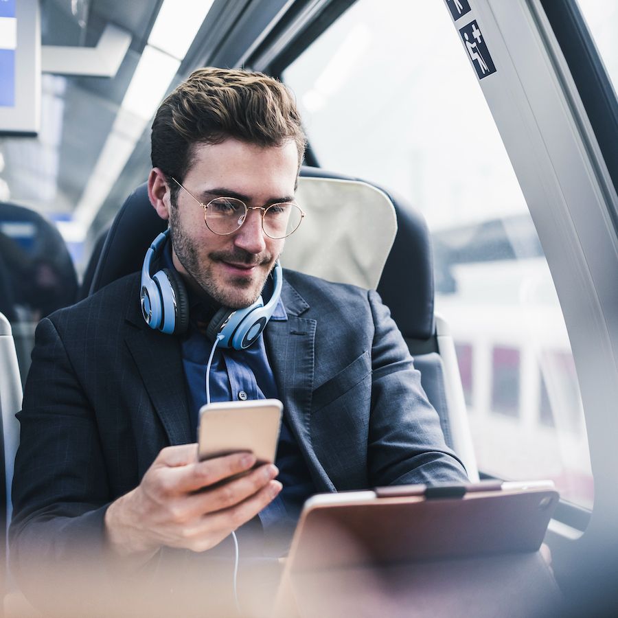 man on train on phone